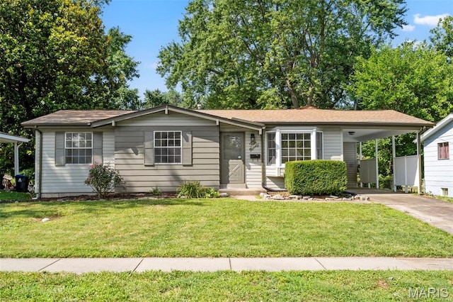 490 Lula Dr, Florissant, MO 63031 - ranch-style home with concrete driveway, an attached carport, and a front yard