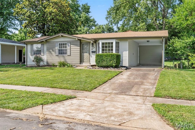 490 Lula Dr, Florissant, MO 63031 - ranch-style home with concrete driveway, a front lawn, and an attached carport