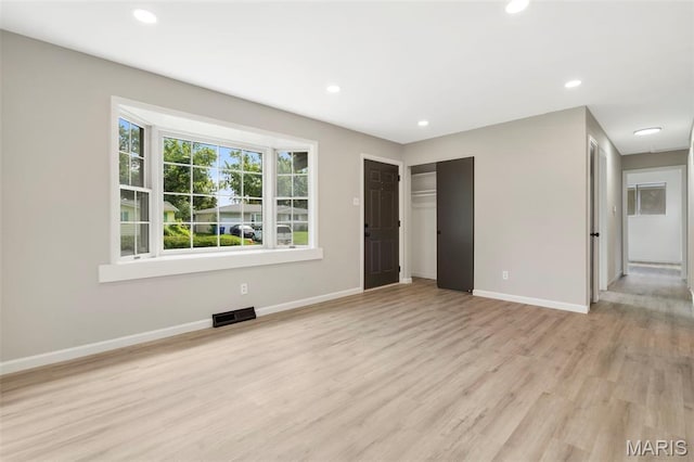 490 Lula Dr, Florissant, MO 63031 - unfurnished bedroom featuring light wood-style floors, recessed lighting, and a closet