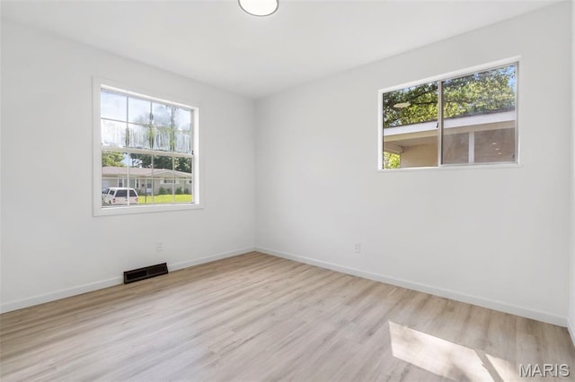 490 Lula Dr, Florissant, MO 63031 - spare room with wood finished floors and baseboards
