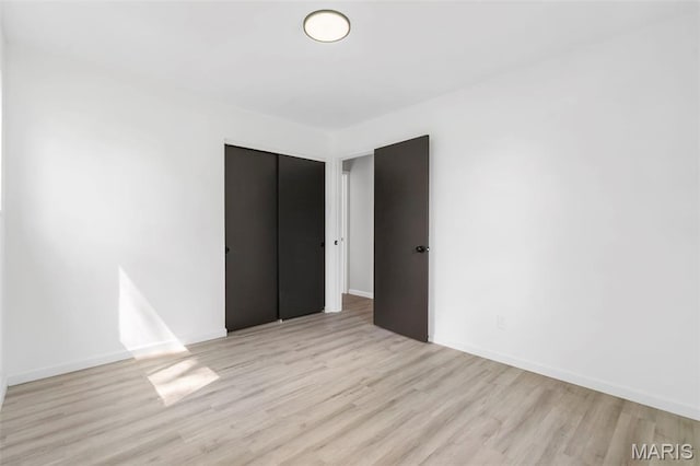 490 Lula Dr, Florissant, MO 63031 - spare room featuring light wood-style floors and baseboards
