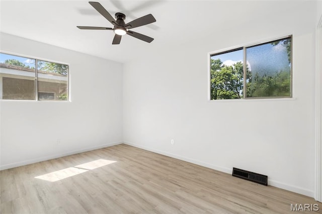 490 Lula Dr, Florissant, MO 63031 - spare room featuring wood finished floors and ceiling fan