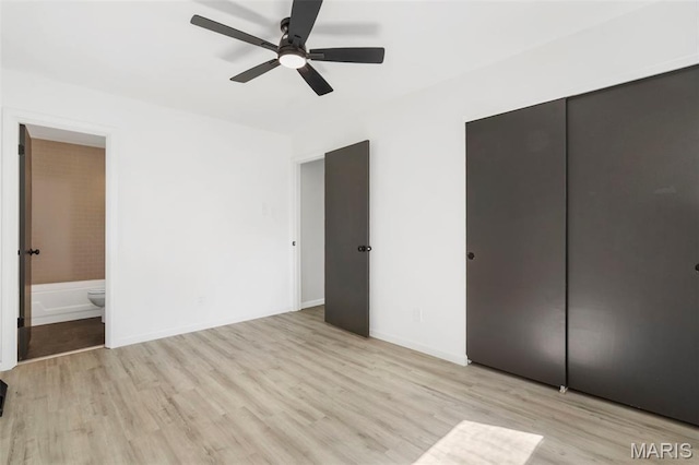 490 Lula Dr, Florissant, MO 63031 - unfurnished bedroom featuring light wood-style floors, ensuite bath, a closet, and ceiling fan