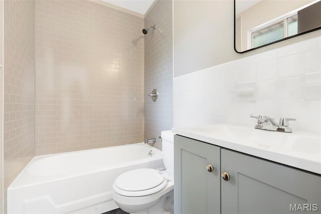 490 Lula Dr, Florissant, MO 63031 - bathroom featuring vanity, shower / bathtub combination, and tile walls