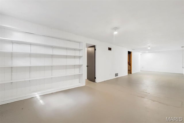 490 Lula Dr, Florissant, MO 63031 - spare room featuring finished concrete flooring