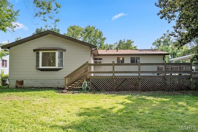 490 Lula Dr, Florissant, MO 63031 - back of property featuring a deck and a lawn