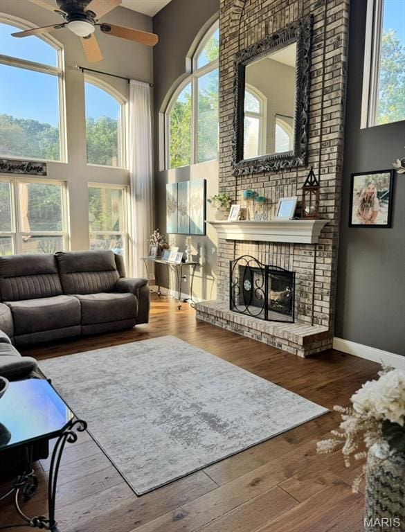 616 Remmick Stables Ct, Ofallon, MO 63368 - living room with a towering ceiling, ceiling fan, plenty of natural light, and hardwood / wood-style floors