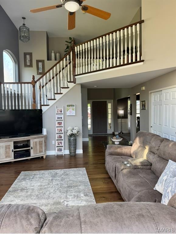 616 Remmick Stables Ct, Ofallon, MO 63368 - living area with a towering ceiling, ceiling fan, plenty of natural light, wood finished floors, and stairs
