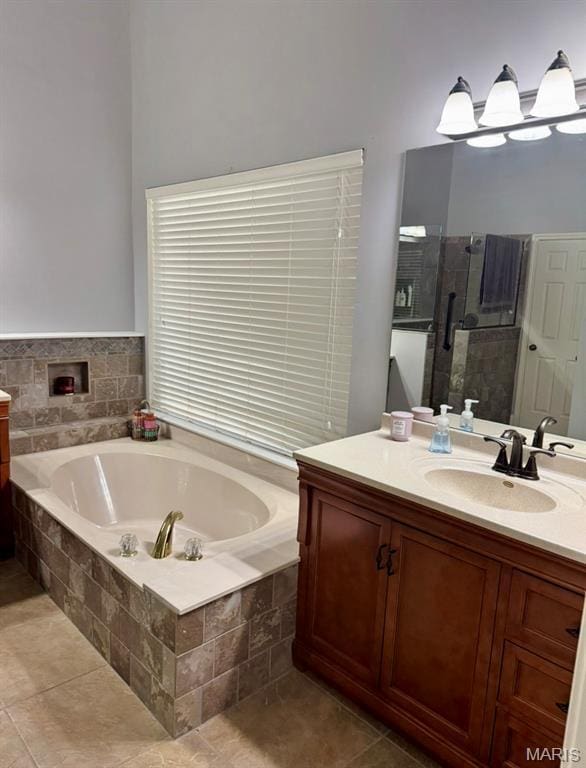 616 Remmick Stables Ct, Ofallon, MO 63368 - bathroom with vanity, a bath, tile patterned floors, and a shower stall