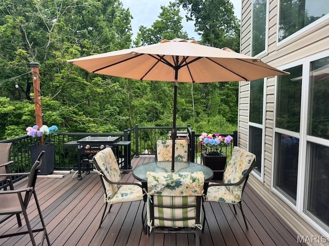 616 Remmick Stables Ct, Ofallon, MO 63368 - wooden terrace featuring outdoor dining area and a grill