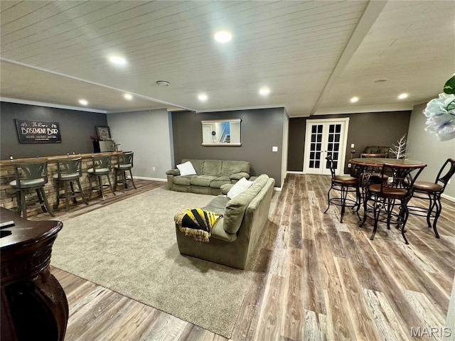 616 Remmick Stables Ct, Ofallon, MO 63368 - living room featuring french doors, wood finished floors, a dry bar, and recessed lighting
