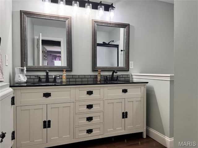 616 Remmick Stables Ct, Ofallon, MO 63368 - full bath with double vanity and wood finished floors