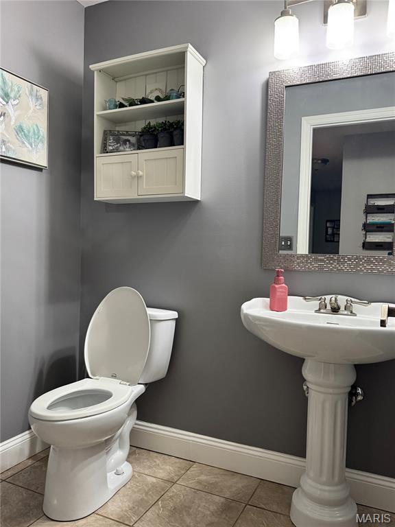 616 Remmick Stables Ct, Ofallon, MO 63368 - bathroom with toilet and tile patterned flooring