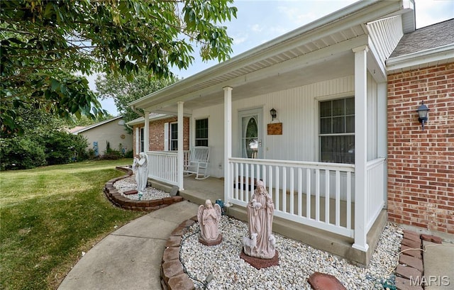 4605 Fountain Brook Dr, Waterloo, IL 62298 - property entrance featuring brick siding, a porch, and a lawn