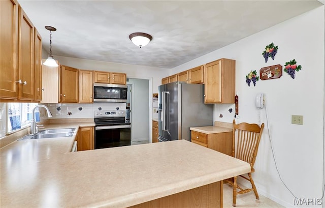 4605 Fountain Brook Dr, Waterloo, IL 62298 - kitchen featuring stainless steel appliances, light countertops, a peninsula, pendant lighting, and tasteful backsplash