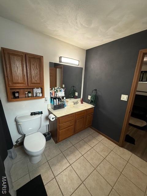 130 Regency Pl, Millstadt, IL 62260 - bathroom with vanity, tile patterned flooring, and a textured ceiling