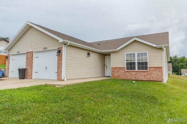 100 Edna St Unit B, Waynesville, MO 65583 - single story home featuring brick siding, a front yard, concrete driveway, an attached garage, and a shingled roof