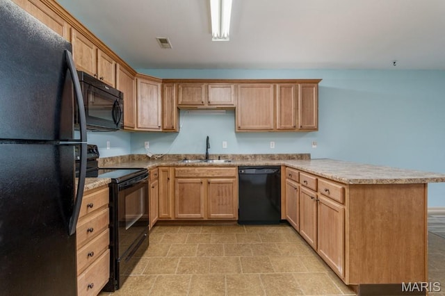 100 Edna St Unit B, Waynesville, MO 65583 - kitchen featuring black appliances, a peninsula, and light countertops