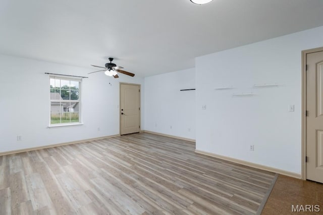100 Edna St Unit B, Waynesville, MO 65583 - unfurnished living room with a ceiling fan and light wood-style floors