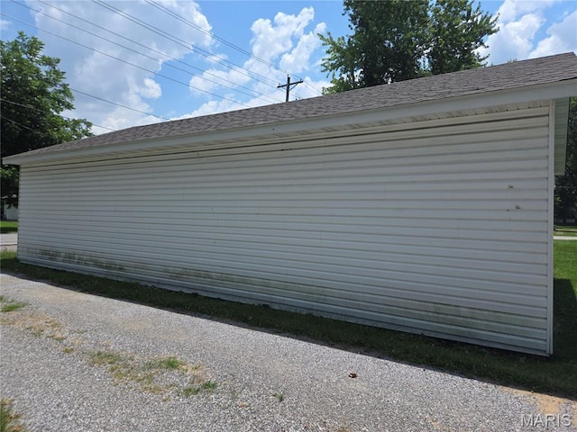 215 S Jefferson St, Mascoutah, IL 62258 - view of side of property with roof with shingles