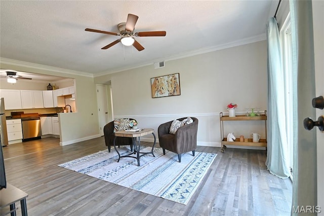 2745 Westphalia Ct Unit F, Oakville, MO 63129 - living area with ceiling fan, wood finished floors, and ornamental molding