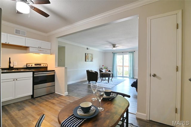 2745 Westphalia Ct Unit F, Oakville, MO 63129 - dining area with a ceiling fan, crown molding, wood finished floors, and a textured ceiling