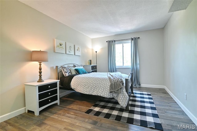 2745 Westphalia Ct Unit F, Oakville, MO 63129 - bedroom featuring a textured ceiling and wood finished floors