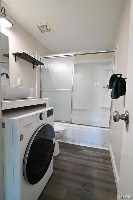 2745 Westphalia Ct Unit F, Oakville, MO 63129 - bathroom featuring washer / clothes dryer, combined bath / shower with glass door, vanity, and wood finished floors