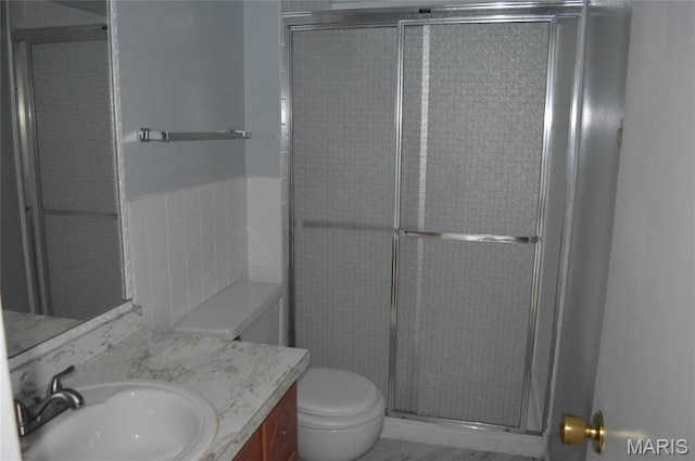 1726 Mayenne Ct, Saint Louis, MO 63125 - full bathroom featuring vanity, a stall shower, and tile walls