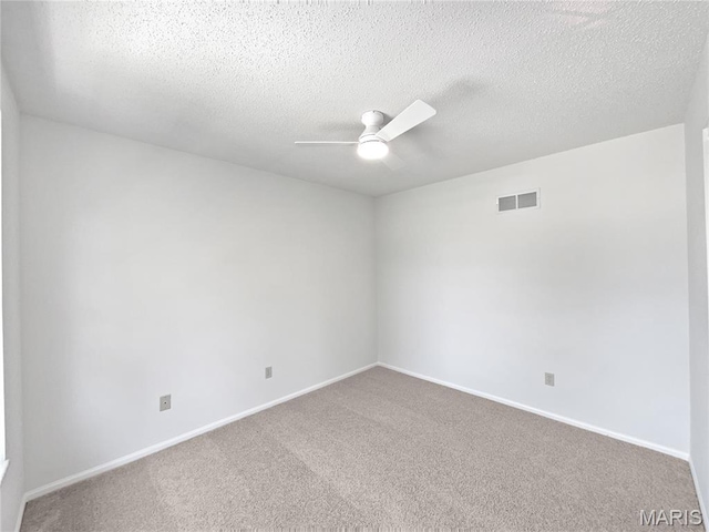 4033 Treeshadow Dr, Saint Peters, MO 63376 - empty room featuring ceiling fan, carpet floors, and a textured ceiling