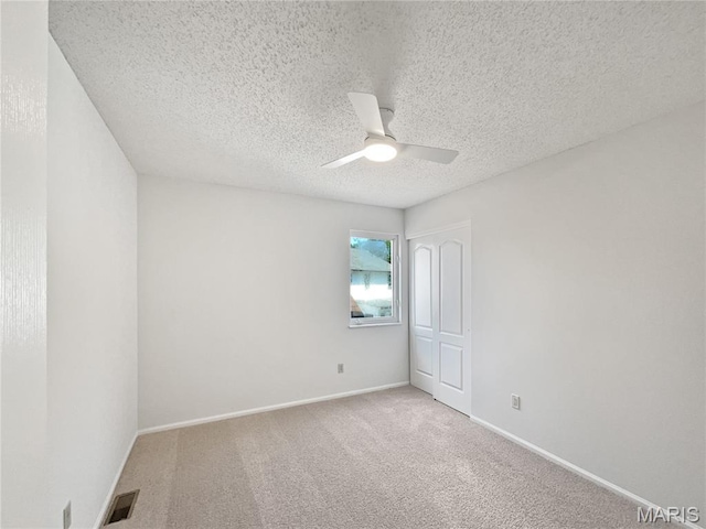 4033 Treeshadow Dr, Saint Peters, MO 63376 - carpeted empty room with a ceiling fan and a textured ceiling