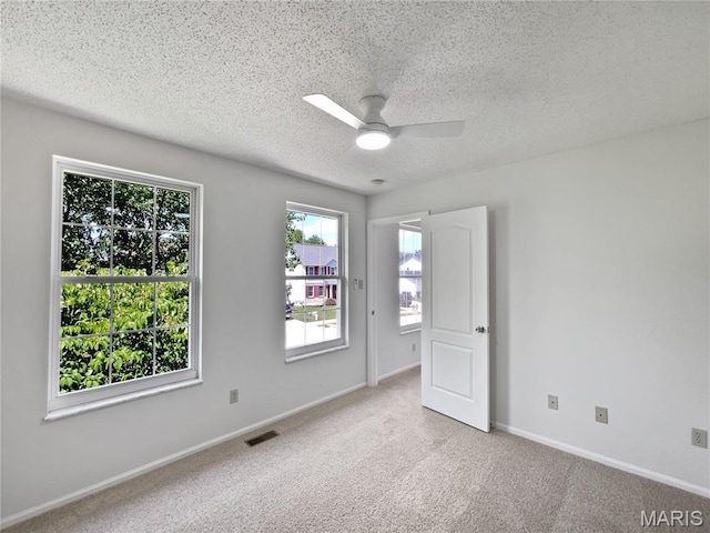 4033 Treeshadow Dr, Saint Peters, MO 63376 - unfurnished bedroom featuring a textured ceiling, carpet flooring, and a ceiling fan