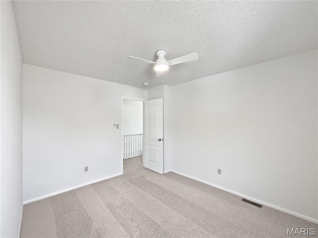 4033 Treeshadow Dr, Saint Peters, MO 63376 - carpeted empty room with a ceiling fan and a textured ceiling