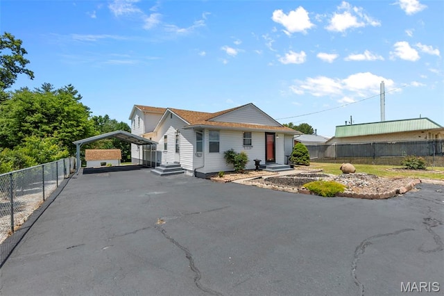 5748 State Highway 25, Cape Girardeau, MO 63701 - view of front of house with a carport and asphalt driveway