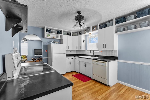 5748 State Highway 25, Cape Girardeau, MO 63701 - kitchen with white appliances, ceiling fan, open shelves, dark countertops, and wainscoting