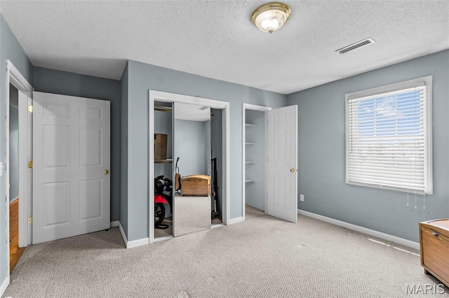 5748 State Highway 25, Cape Girardeau, MO 63701 - unfurnished bedroom with carpet flooring, a textured ceiling, and a closet