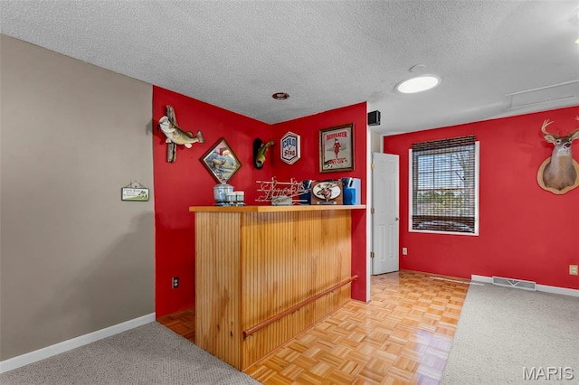 5748 State Highway 25, Cape Girardeau, MO 63701 - indoor dry bar featuring a textured ceiling and baseboards