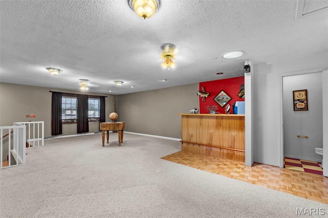 5748 State Highway 25, Cape Girardeau, MO 63701 - reception with a dry bar, a textured ceiling, and a ceiling fan