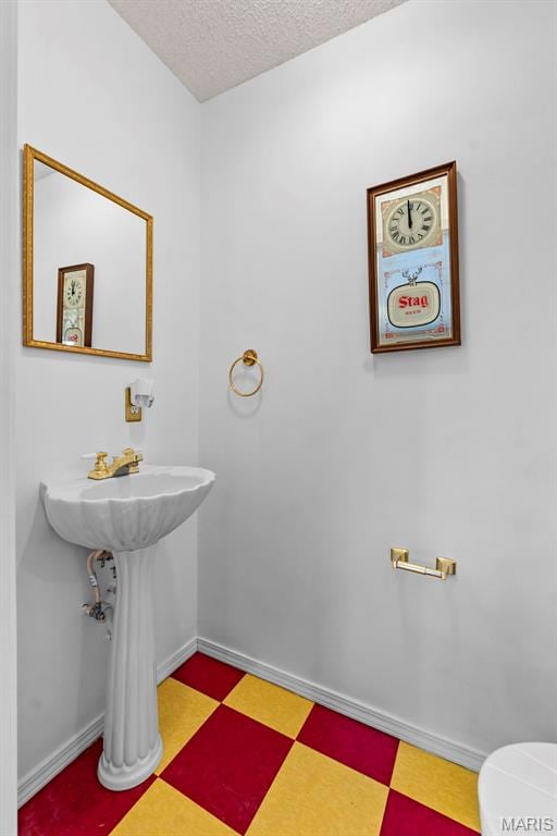5748 State Highway 25, Cape Girardeau, MO 63701 - bathroom with tile patterned floors and a textured ceiling