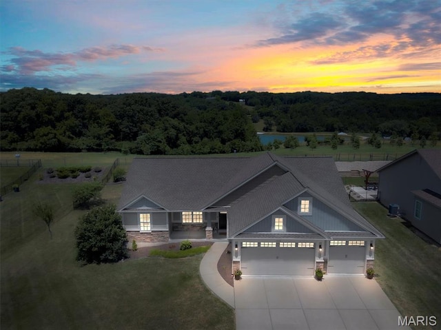 1209 Riesling Ln, Pevely, MO 63070 - craftsman inspired home with stone siding, driveway, an attached garage, and a wooded view