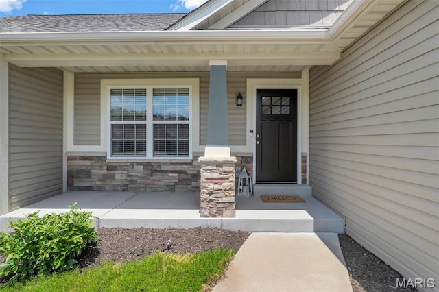 1209 Riesling Ln, Pevely, MO 63070 - doorway to property with a shingled roof, a porch, and stone siding