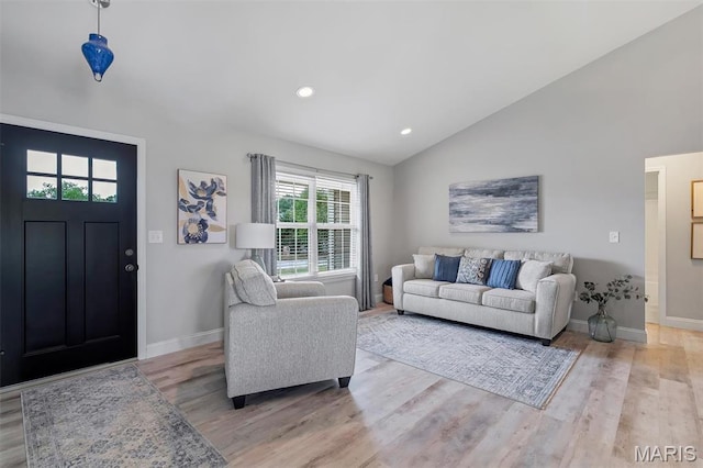 1209 Riesling Ln, Pevely, MO 63070 - living room with light wood-style floors, vaulted ceiling, and recessed lighting