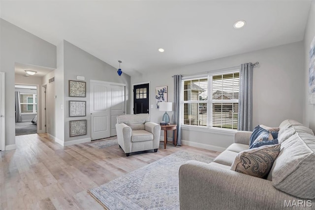 1209 Riesling Ln, Pevely, MO 63070 - living room featuring wood finished floors, recessed lighting, and high vaulted ceiling