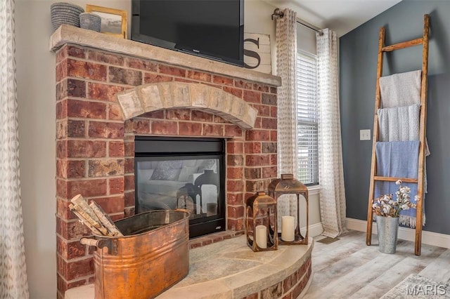 1209 Riesling Ln, Pevely, MO 63070 - detailed view of wood finished floors and a brick fireplace
