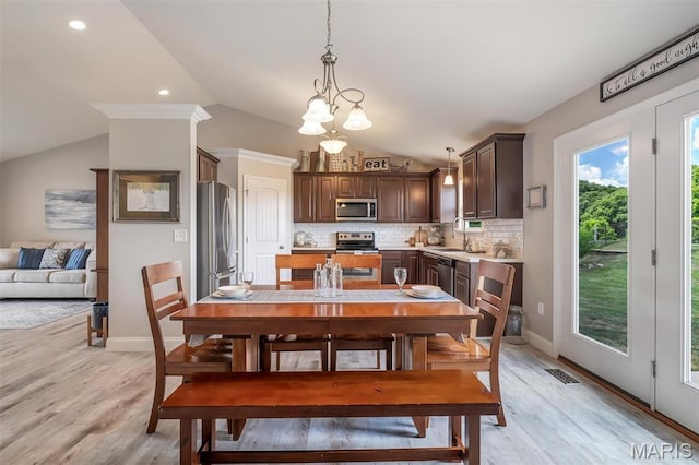 1209 Riesling Ln, Pevely, MO 63070 - dining area with vaulted ceiling and light wood-style flooring