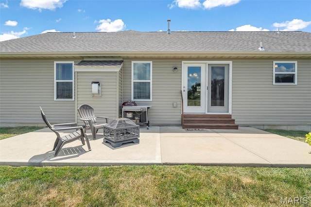 1209 Riesling Ln, Pevely, MO 63070 - back of house featuring entry steps, a fire pit, a patio, and a yard