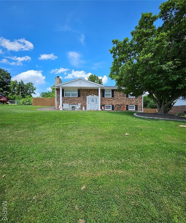 22 Settlers Trl, Hannibal, MO 63401 - view of front of house with a chimney and brick siding