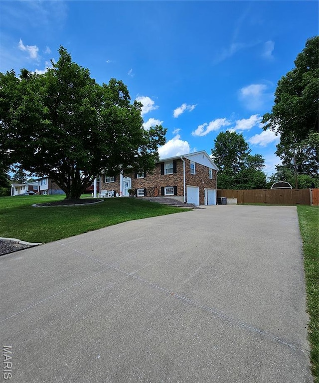 22 Settlers Trl, Hannibal, MO 63401 - view of front of house with an attached garage and driveway