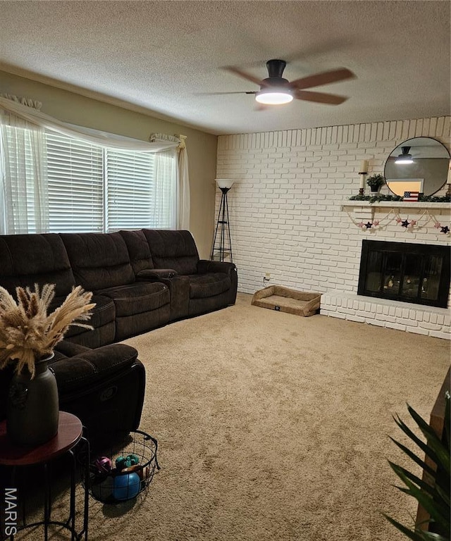 22 Settlers Trl, Hannibal, MO 63401 - living area with a ceiling fan, carpet floors, a textured ceiling, a brick fireplace, and brick wall