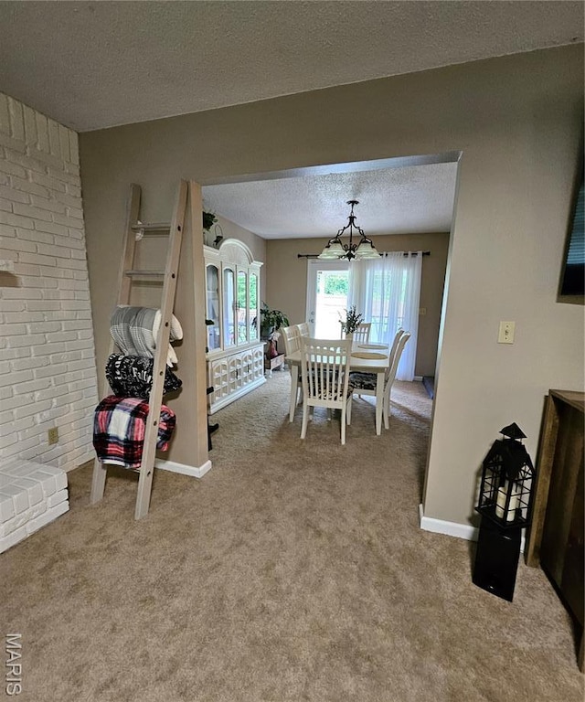 22 Settlers Trl, Hannibal, MO 63401 - carpeted dining space with a textured ceiling and a chandelier